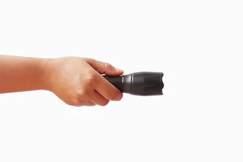 Black flashlight in human hands, isolated on a white background with the cl.. Stock Photos