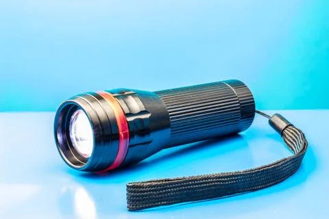 Black flashlight, shining Stock Photos