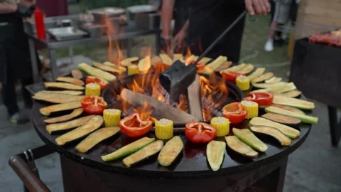 Black flat grill, round shape, with a hole with a fire in the center. 動画素材 337038900