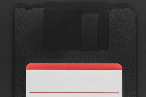 Black floppy disk on black background Stock Photos