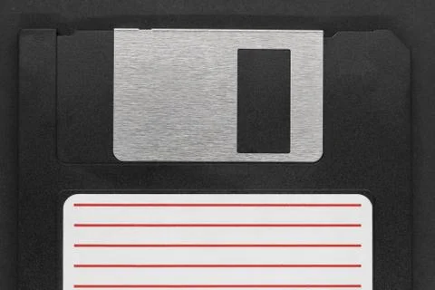 Black floppy disk on black background Foto stock