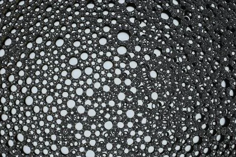 Black foam bubbles creating abstract monochrome texture background Stock Photos