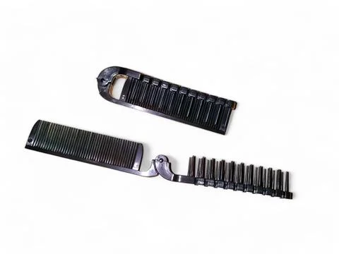 Black folding comb on a white background Stock Photos