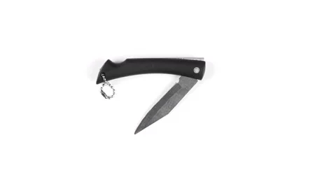 Black folding knife on a white Stock Footage 126918928