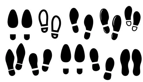 Black footprint silhouette vector set showing various shoe print shapes and Stock Illustration