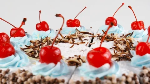 Black Forest gateau with whipped cream and red cherries on top Stock Footage 87175282