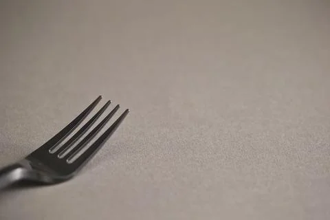 Black fork on gray background Stock Photos