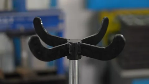 Black four pronged metal support saddle of a transmission jack. Vídeo Stock 343891221