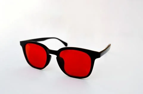 Black frame red lens glasses for blue light blocking and nighttime screen use Stock Photos