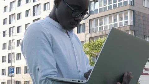 Black freelancer student studying online working outdoors in internet Stock Footage 136097227