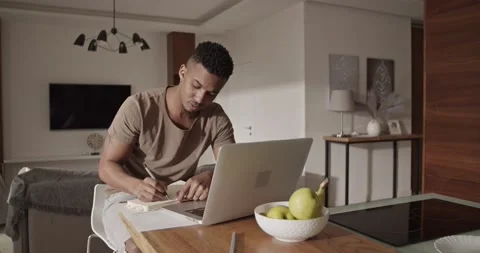 Black freelancer using laptop for work Stock Footage 181703466