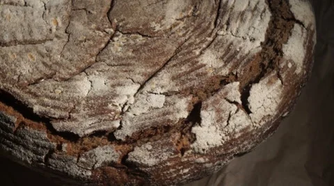 Black fresh bread moving on a stand Stock Footage 67675074