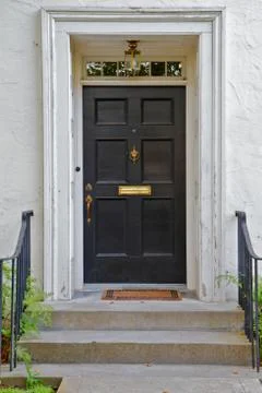 Black front door Stock Photos