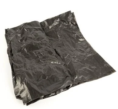 Black garbage bags for sorting garbage. Garbage bag for the container. 库存照片