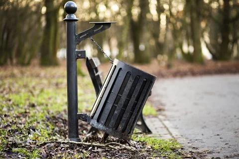 Black garbage bin in park, Solvay Park, Krakow, Lesser Poland, Poland Фото