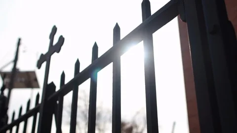 Black gate cross angle sun flare Video stock 99208814