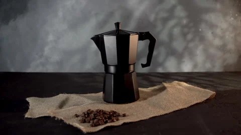Black Geyser Coffee Maker on Textured Fabric, Low-Light Setting Stock Footage 268104971