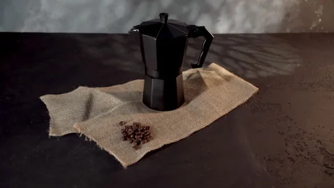 Black Geyser Coffee Maker on Textured Fabric, Low-Light Setting Stock Footage 268105206