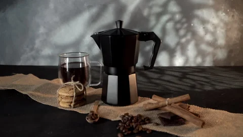 Black Geyser Coffee Maker on Textured Fabric, Low-Light Setting Stock Footage 268105367