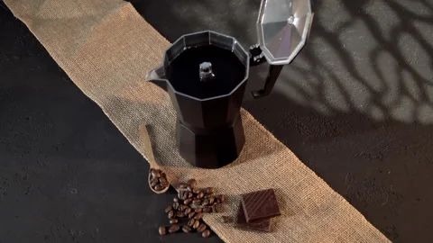 Black Geyser Coffee Maker on Textured Fabric, Low-Light Setting Stock Footage 268106565