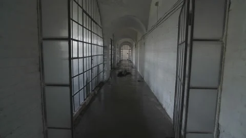 A black ghost of a woman wanders in an old abandoned psychiatric hospital. Stock Footage 112951166