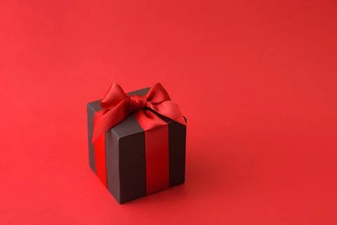 Black gift box with red bow Stock Photos