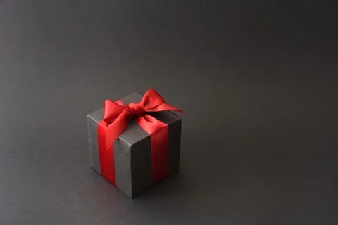 Black gift box with red bow Stock Photos