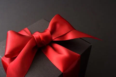 Black gift box with red bow Stock Photos