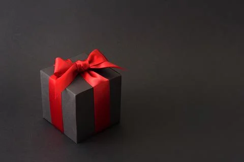 Black gift box with red bow Fotos Stock