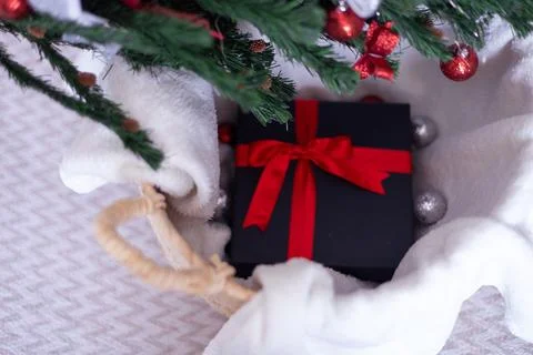 Black gift box with a red bow Stock Photos