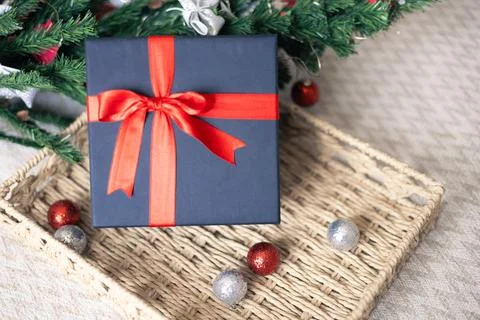 Black gift box with a red bow Stock Photos