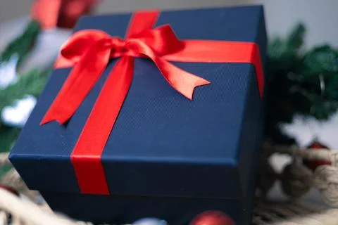 Black gift box with a red bow Stock Photos