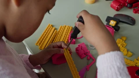 Black Girl Assembling Robotics Toy with Screwdriver in Stem Lesson Stock Footage 339191501