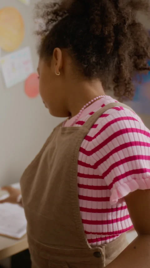 Black Girl Packing School Backpack with Homework Assignment Stock Footage 337565566