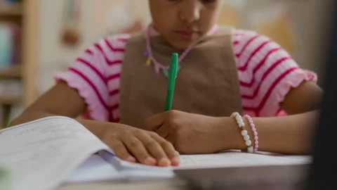 Black Girl Writing in Notebook, Studying for Online School Lesson Stock Footage 337565898