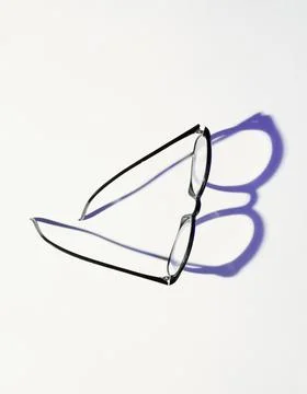 Black Glasses Casting Shadow Stock Photos