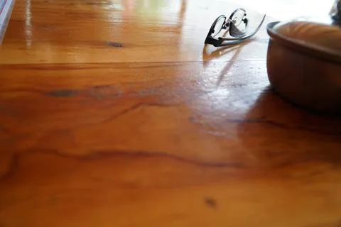 Black glasses lie on a table Stock Photos