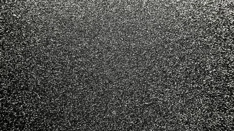 Black glitter background with shimmering silver sparkles and abstract dark te Photos