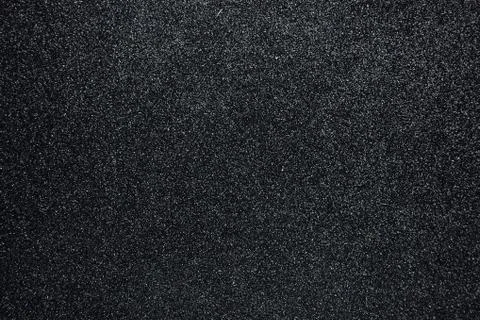 Black glitter sandpaper background with texture, Close-up Фото