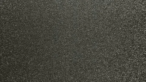 Black glitter texture background with shimmering dark metallic particles and  写真素材