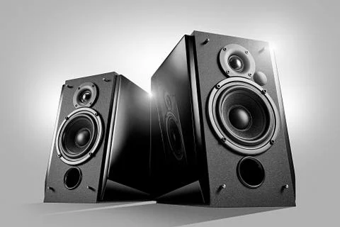 Black glossy music speakers on light grey background Stock Photos