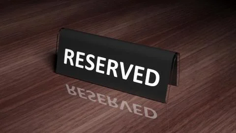 Black glossy reservation sign on wooden surface with reflection Stock Photos