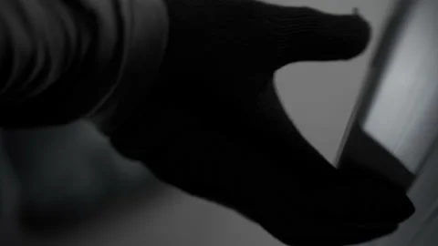 A black-gloved hand opens the door and a man enters the room. Opening of a white Stock Footage 217188462