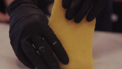  black gloved hands making pasta dough, pizza dough. Stock Footage 300028255