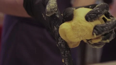  black gloved hands making pasta dough, pizza dough. Stock Footage 300028353