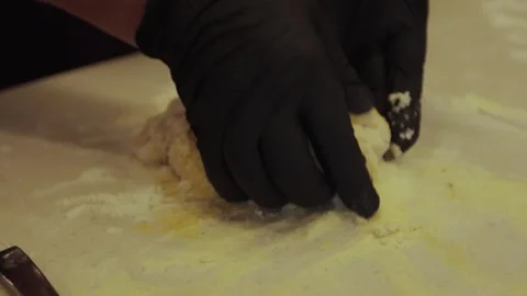 Black gloved hands making pasta dough, pizza dough. Stock Footage 300028373