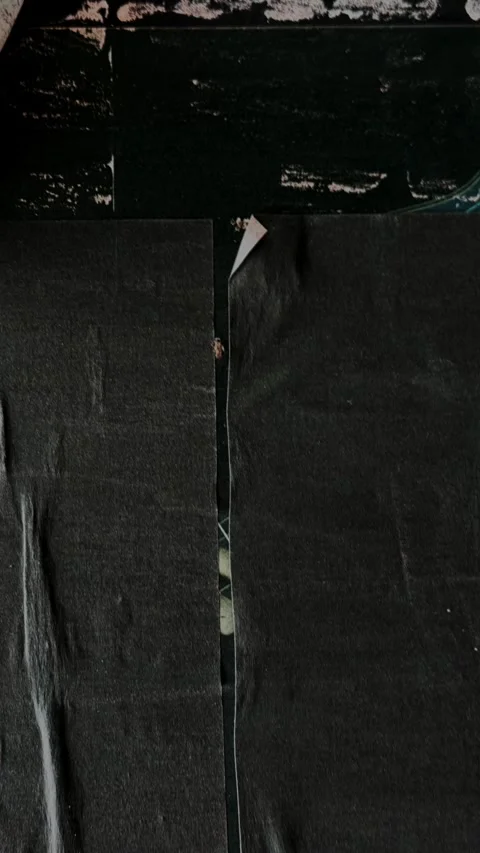 Black glued paper texture on wall Video stock 347453341