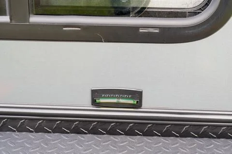 Black Graduated Level attached to the side of a silver teardrop camper Stock Photos