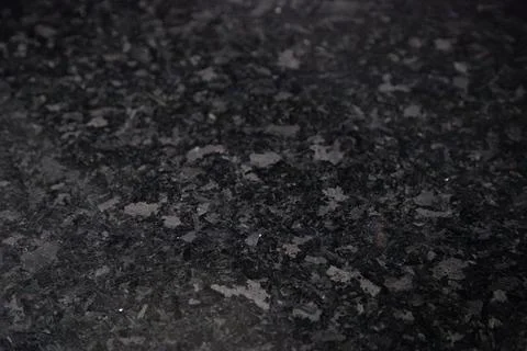 Black granite texture background with selective focus and copy space Stock Photos