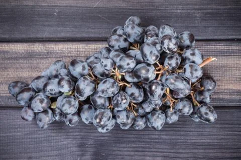 Black grapes on the table top view still life Stock Photos